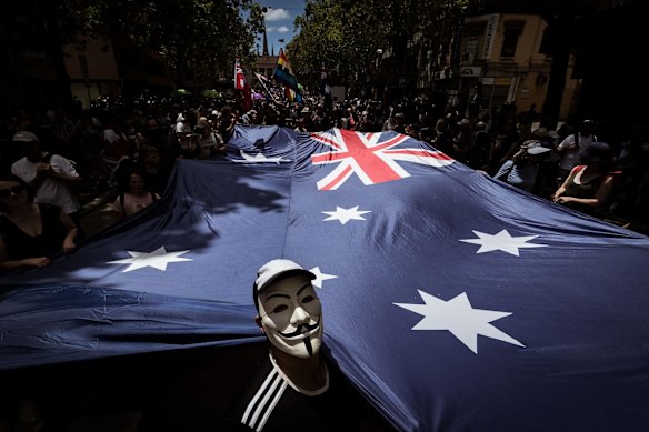 Protesters walk down Bourke Street on November 27, 2021 in Melbourne, Australia. People gathered in Melbourne to protest against mandatory vaccination. 