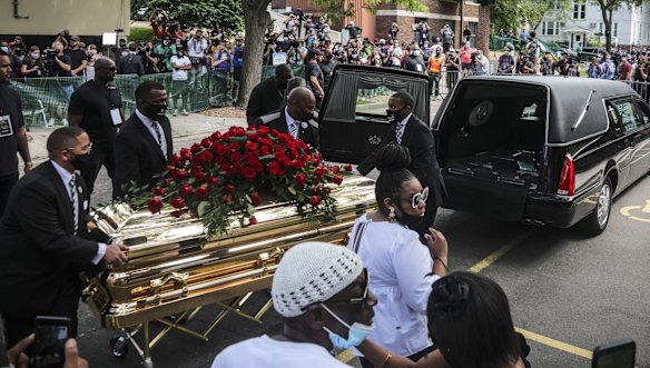 George Floyd's casket is carried to a hearse after his funeral at North Central University, Minneapolis.