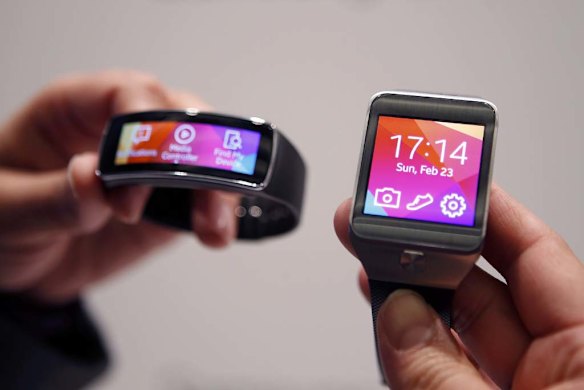 The Samsung Gear Fit fitness band, left, and Gear 2 smart watch.