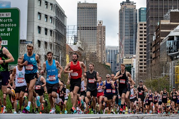 Runners head down Williams Street at the start of the City2Surf.