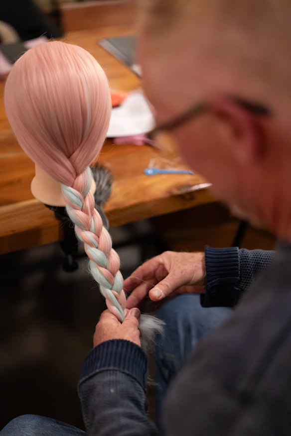 Jim Carroll attended the workshop with his son, Shou Matsui-Carroll. He wants to improve his hairstyling skills for his granddaughters.  