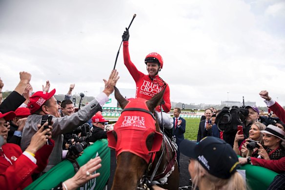 Jockey Kerrin McEvoy smiles after riding Redzel to win the TAB Everest horse race.
