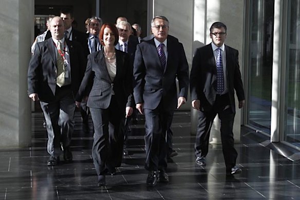 Prime Minister Julia Gillard emerges from the leadership ballot with Wayne Swan after defeating Kevin Rudd.
