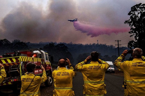 The LAT (Large Aerial Tanker), a custom fire fighting 737 dumps water on a bushfire south of Port Macquarie. 