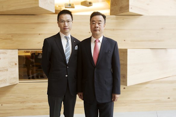 Dr Chau Chak with his son Eric.