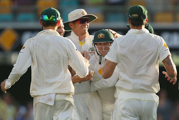 George Bailey oand the Aussies celebrate after he took the catch to dismiss Chris Tremlett.