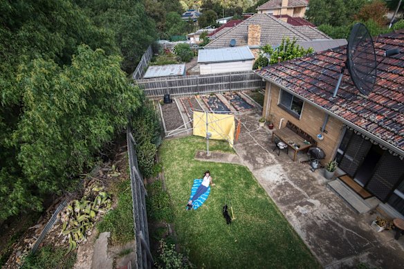 Miriam enjoys the sunshine in her back yard.
