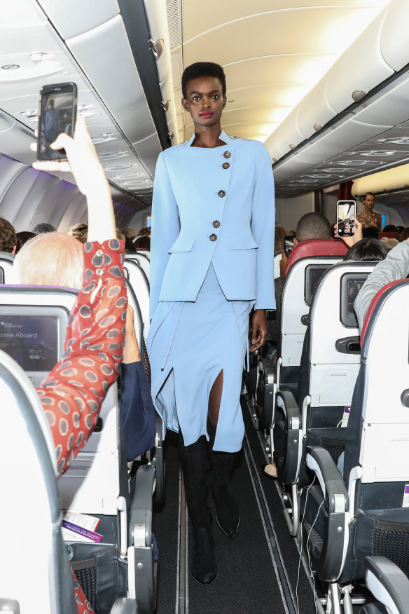 More than 200 paid passengers were on board the flight for the four-minute fashion show.