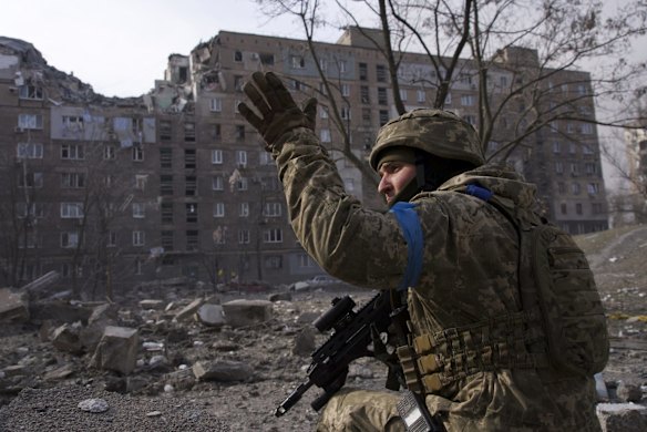 A Ukrainian serviceman guards his position in Mariupol, Ukraine.