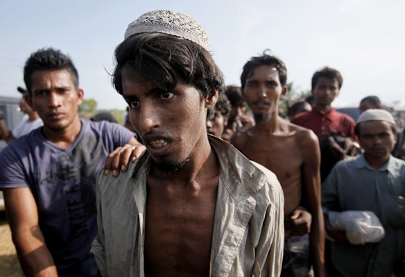 Rescued migrants arrive in Simpang Tiga, Aceh province, Indonesia Wednesday, May 20, 2015. Hundreds of migrants stranded at sea for months were rescued and taken to Indonesia, officials said Wednesday, the latest in a stream of Rohingya and Bangladeshi migrants to reach shore in a growing crisis confronting Southeast Asia. 