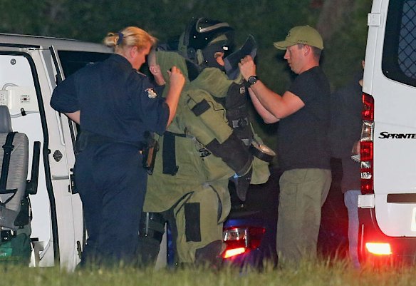 Bomb squad getting suited up at the scene of the Endeavour Hills shooting.