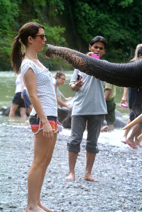 Tourists interact with the elephants in Tangkahan, North Sumatra.
