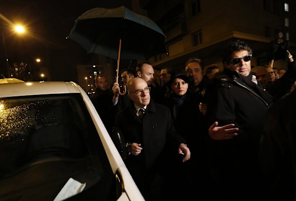 French Education Minister Najat Vallaud-Belkacem (fron row, C) and French Interior Minister Bernard Cazeneuve (front row, L) arrive at the end of a demonstration at the end of Shabbat called by the Union of French Jewish Students (UEJF) near the kosher supermarket where an attack was carried out earlier this week, near Porte de Vincennes in eastern Paris January 10, 2015. In the worst assault on France's homeland security for decades, 17 victims were killed in three days of violence that began with an attack on the Charlie Hebdo weekly on Wednesday and ended with Friday's dual sieges at a print works outside Paris and a Jewish deli in the city.