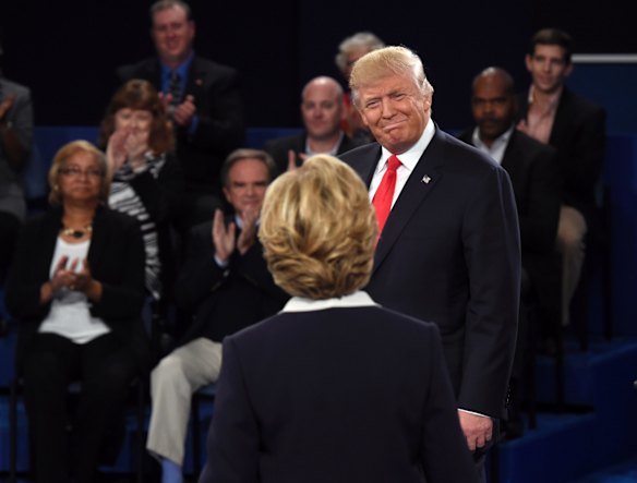 Republican presidential nominee Donald Trump greets Democratic presidential nominee Hillary Clinton before the second presidential debate.