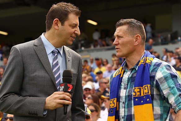 Commentator Basil Zempilas speaks to boxer Danny Green before the game.