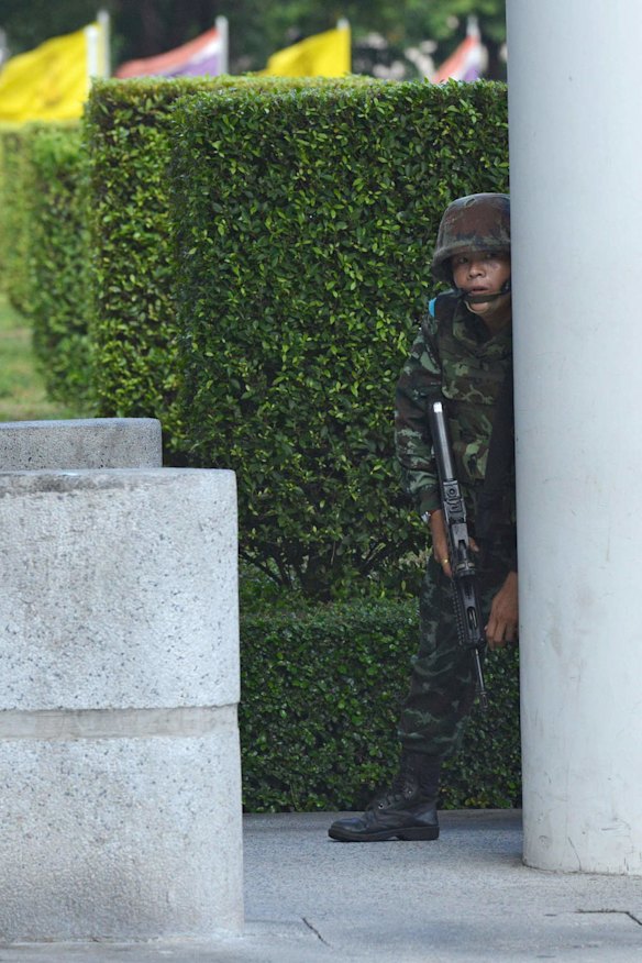 Thai army soldiers secure the grounds of the venue for peace talks between pro- and anti-government groups in Bangkok.