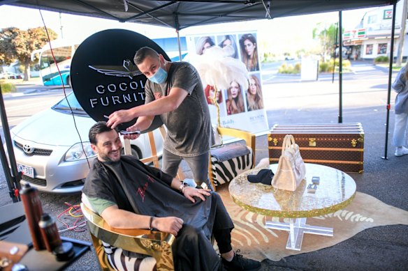 Ibiza Hair salon owner Michael Piastrino with customer, Michael Fouyaxis on the first trading day after lockdown.