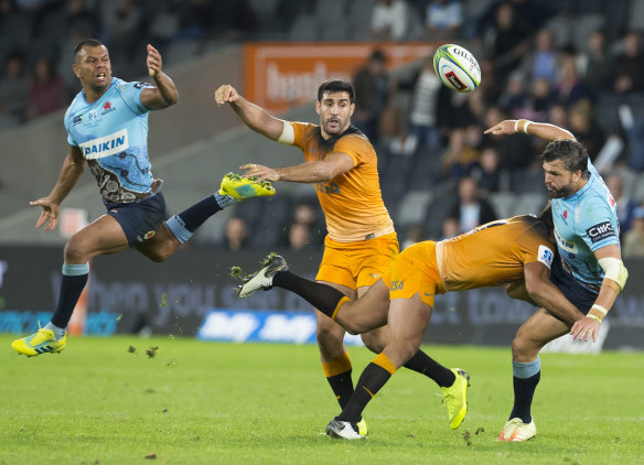 Crunch time: Adam Ashley-Cooper is upended and the ball comes loose with Kurtley Beale in support.