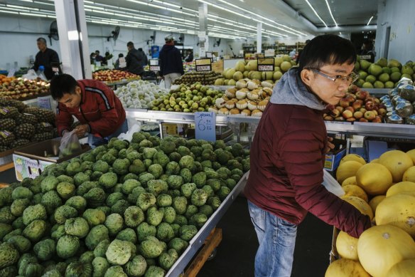 Customers check out the fresh fruit and vegetable available in a number of shops in Bankstown.