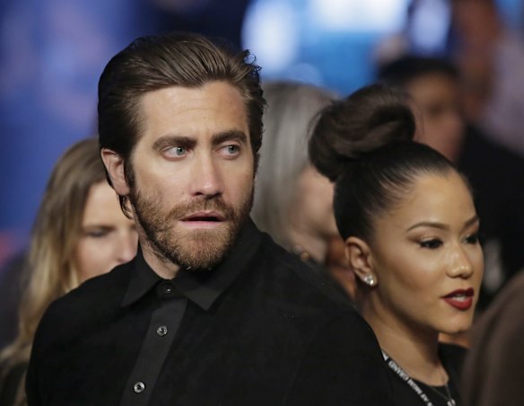 Actor Jake Gyllenhaal watches the action before the start of the world welterweight championship bout between Floyd Mayweather Jr., and Manny Pacquiao.
