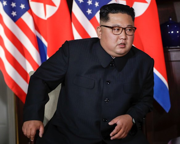 North Korea leader Kim Jong Un leans in to listen to U.S. President Donald Trump during their first meeting.