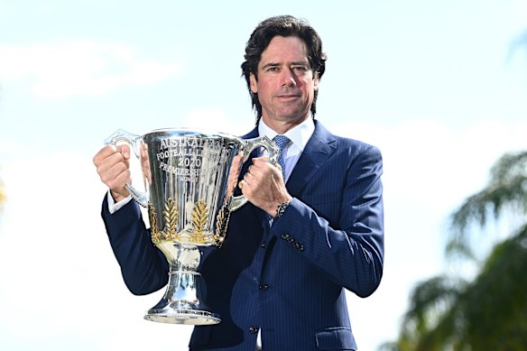 AFL Chief Executive Gillon McLachlan poses with the Premiership Trophy during a press conference announcing to media from the Queensland Quarantine Hub that the 2020 AFL Grand Final will be played at the Gabba on September 02, 2020 on the Gold Coast