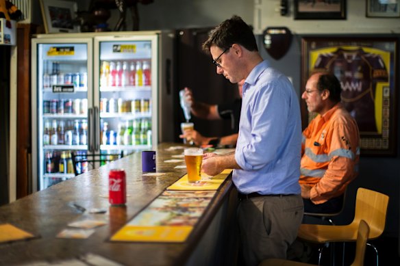Minister for Agriculture and Water Resources David Littleproud buys a beer at the Tambo Tavern, in Tambo, Queensland.