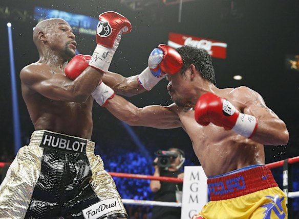 Manny connects with a right to the head of Floyd.