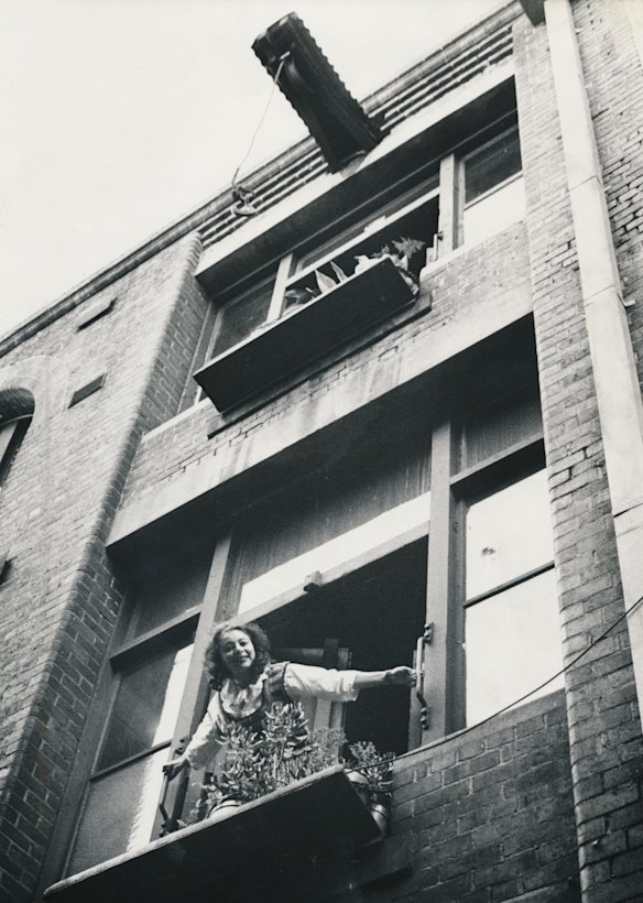 Mirka Mora leans out the window of her city studio-apartment in Rankins Lane, near the GPO, in the heart of Melbourne's CBD in 1980.