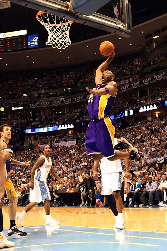 2009: Kobe Bryant of the Los Angeles Lakers dunks the ball against the Denver Nuggets in Game Six of the Western Conference Finals during the 2009 NBA Playoffs in Denver, Colorado. 