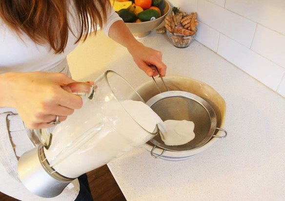 Step 5: Strain the almond milk through a fine metal sieve to separate meal from milk.