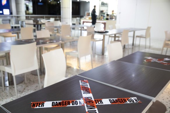 Food courts have restricted table space with many tables off limits.