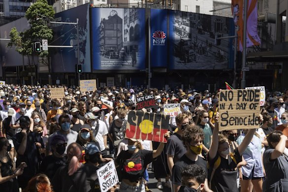 Protestors move through the CBD in Sydney during an Invasion Day March