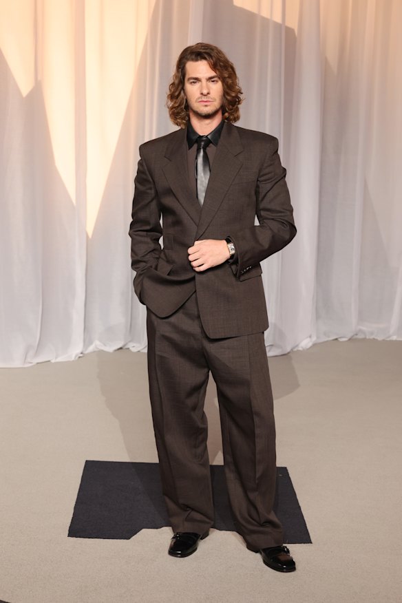 Andrew Garfield rocks long locks at the Academy Museum Gala.