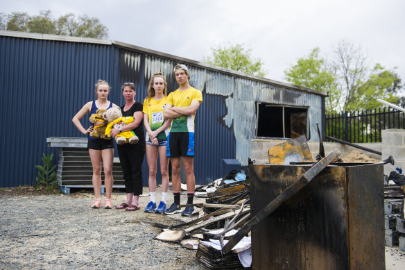Woden Little Athletics Club secretary Mel Hardy, second from left, says it will go ahead with a meet on the weekend after Monday's devastating fire. 