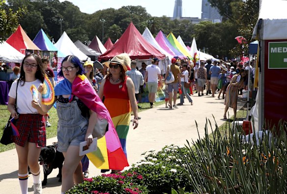 The crowd enjoy the festivities and entertainment at the Gay & Lesbian Mardi Gras Fair Day at Victoria Park, Sydney.