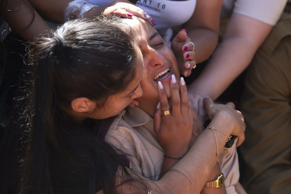 Friends and relatives of Israeli soldier Omer Tabib, 21, mourn during his funeral at the cemetery in the northern Israeli town of Elyakim, Thursday, May 13, 2021. The Israeli army confirmed that Tabib was killed in an anti-tank missile attack near the Gaza Strip, the first Israeli military death in the current fighting between Israelis and Palestinians.