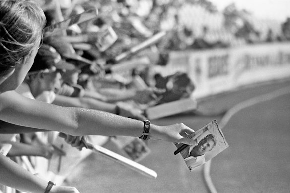 Warne fans try to get the leg-spinner's attention during the second Test against South Africa in Cape Town in March 1994.