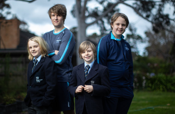 Brothers Henry, Will, Ollie and Charlie model Kingswood College's current and future school uniforms. 