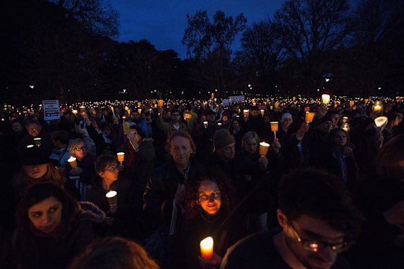 Thousands hold their candles aloft in rememberence of Aylan Kurdi on September 7, 2015 in Melbourne, Australia.