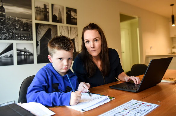 Primary school teacher Megan Gibb balances teaching from home with supervising her son Hudson, who is in year 1 and learning remotely this week.