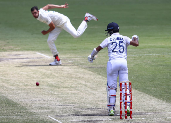 India’s Cheteshwar Pujara plays at a ball from Australia’s Mitchell Starc during play on the final day of the fourth cricket Test between at the Gabba. 