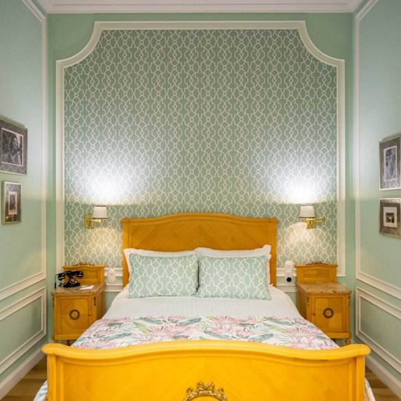 Pastel perfection in a classic guest room at Grande Hotel do Porto in Porto, Portugal.
