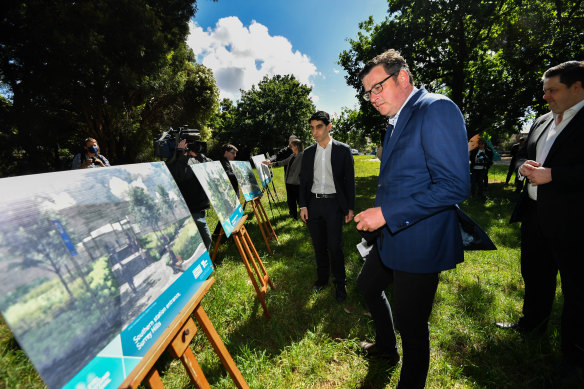 Victorian Premier Daniel Andrews reviews plans of the proposed Surrey Hills-Mont Albert premium railway station. The federal government had promised 500 car spaces towards the Surrey Hills station in 2019.