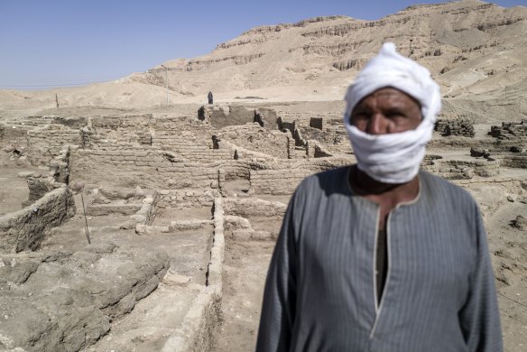 A worker at the site of a 3000 year-old lost city in Luxor, Egypt. Egyptian archaeologists have discovered Aten or “the lost golden city” which is believed to be the largest ancient city ever discovered in Egypt.