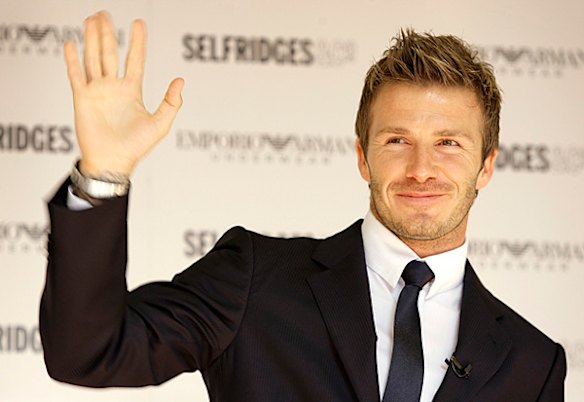 David Beckham waves to the crowd at the launch of the new Autumn/Winter Emporio Armani underwear campaign in London.