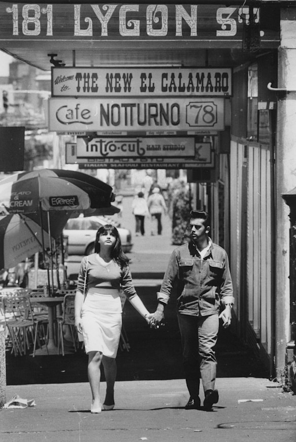 Walking along Lygon Street, Carlton, in the 1980s.
