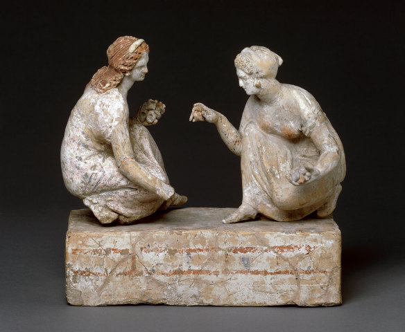 Young women play knucklebones in one of the pieces on display in the Ancient Greeks exhibition.