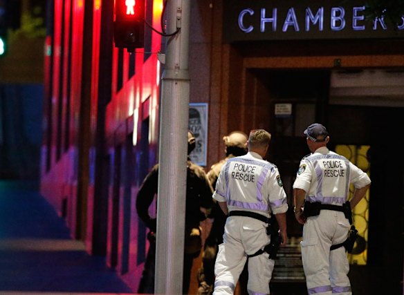 Police officers stand next to Lindt Chocolat Cafe in Martin Place.