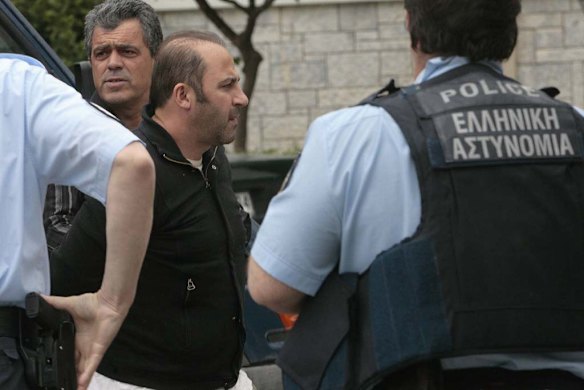 Arriving at Athens' Korydallos prison with a police escort.